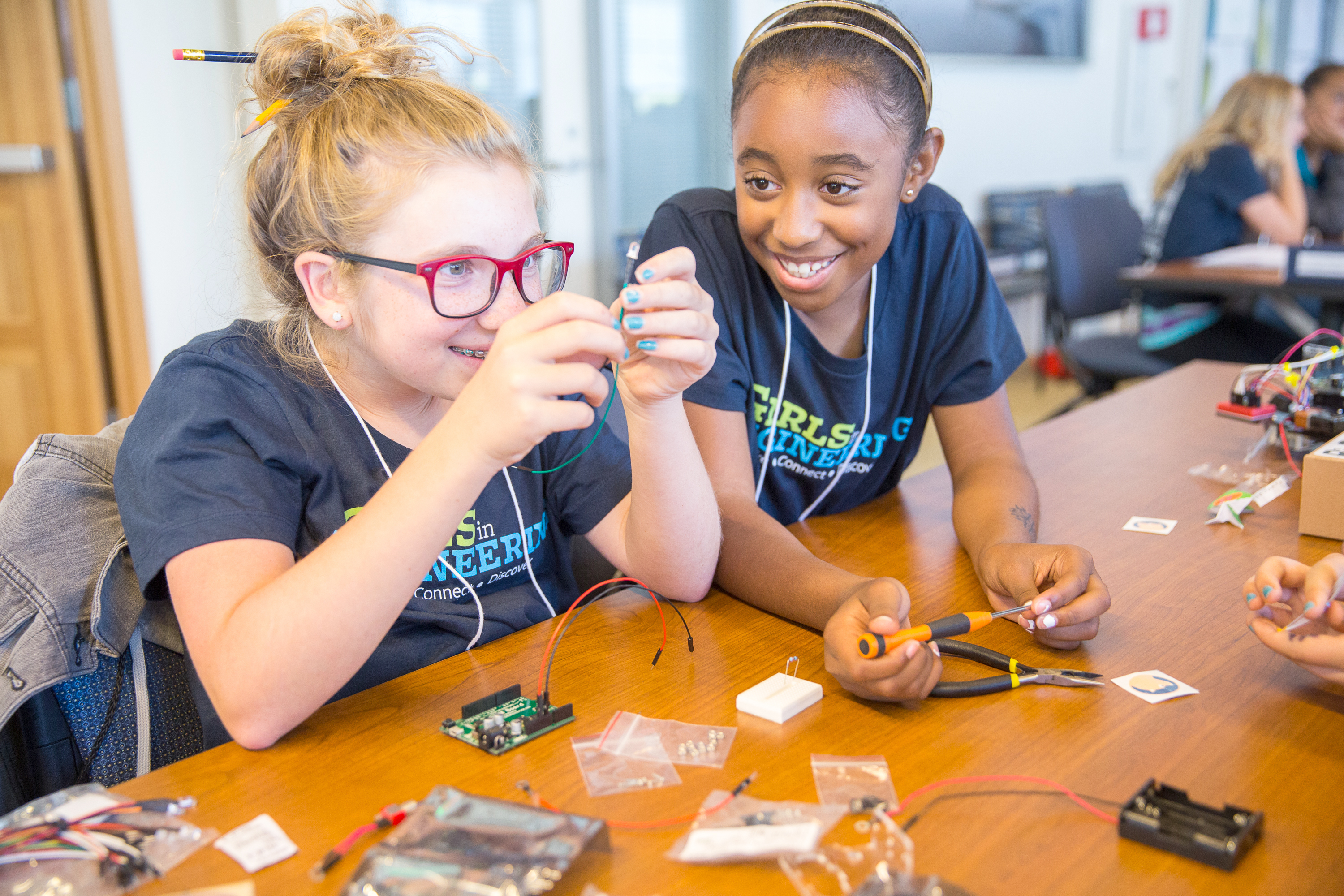 Berkeley Girls in Engineering participants building a robot